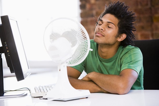 Denver man cools off with fan