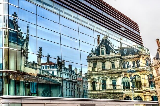 Historical commercial building contrasted with modern commercial building