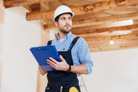 Professional HVAC does inspection on indoor air quality at work